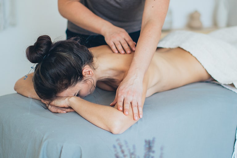our-services Client receiving a massage from a therapist.