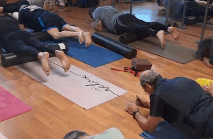 Group of people doing their planking exercise.